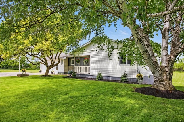 8281 E Main Rd, Leroy, NY 14482 - view of home's exterior featuring a lawn, concrete driveway, and a garage