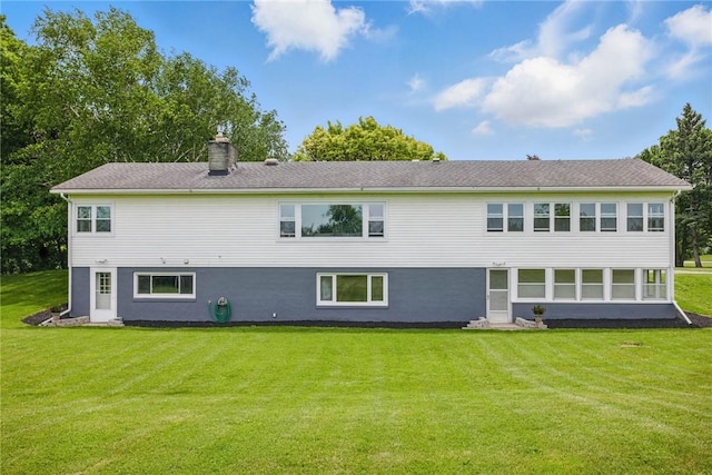 8281 E Main Rd, Leroy, NY 14482 - rear view of house featuring a lawn and a chimney