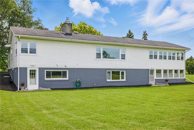 8281 E Main Rd, Leroy, NY 14482 - back of house featuring a chimney, a yard, and stucco siding