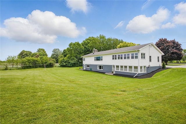 8281 E Main Rd, Leroy, NY 14482 - back of house featuring a yard and a chimney