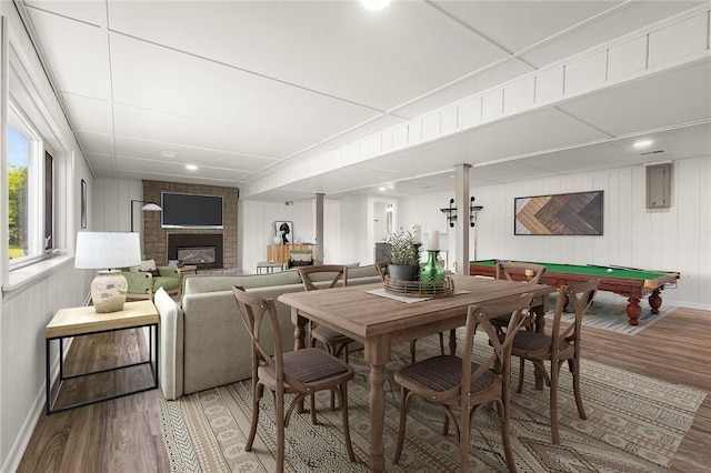 8281 E Main Rd, Leroy, NY 14482 - dining space featuring light wood-type flooring, a fireplace, and billiards