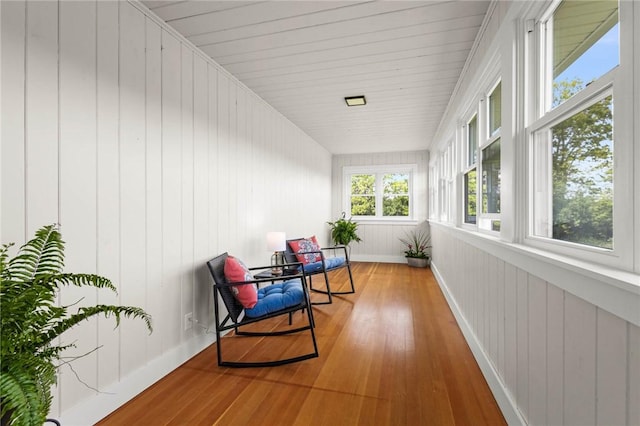 8281 E Main Rd, Leroy, NY 14482 - sunroom / solarium featuring wood finished floors and wooden walls