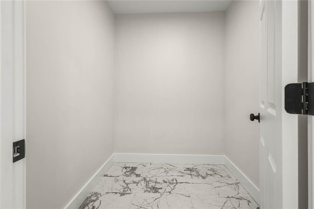 8281 E Main Rd, Leroy, NY 14482 - laundry room featuring marble finish flooring and baseboards