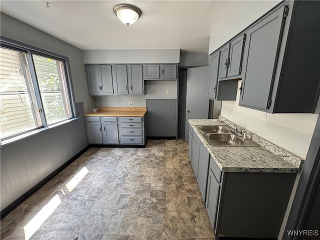360 Longnecker St, Buffalo, NY 14206 - kitchen with gray cabinets, stone finish flooring, and light countertops