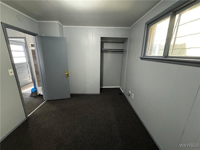 360 Longnecker St, Buffalo, NY 14206 - unfurnished bedroom featuring a closet, crown molding, and dark carpet