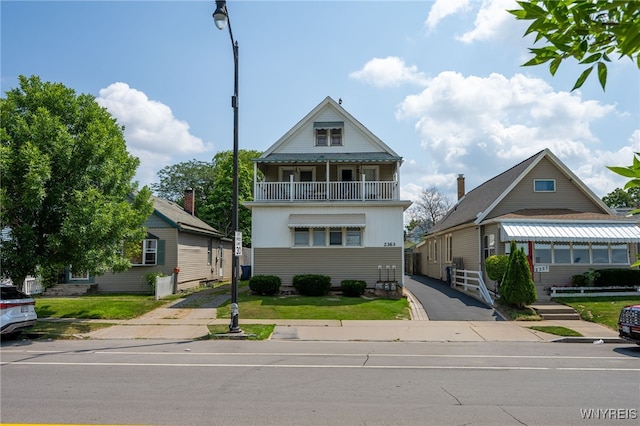 2363 Niagara St, Buffalo, NY 14207 - view of front of property with a balcony and a front yard