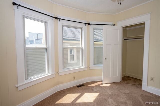 2363 Niagara St, Buffalo, NY 14207 - unfurnished bedroom featuring carpet, ornamental molding, multiple windows, and a closet