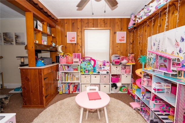 2363 Niagara St, Buffalo, NY 14207 - game room with carpet, crown molding, a ceiling fan, and wood walls