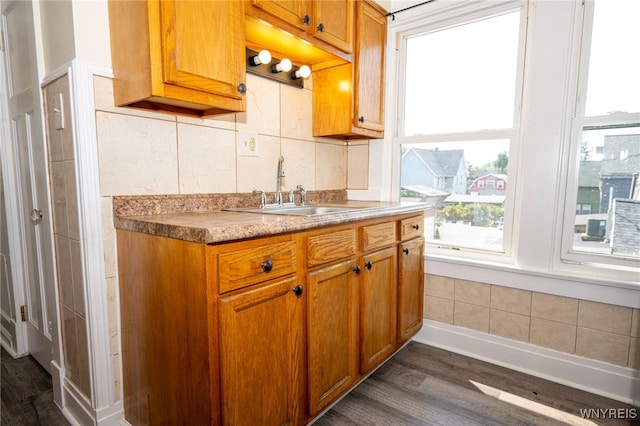 2363 Niagara St, Buffalo, NY 14207 - kitchen with dark wood finished floors, tasteful backsplash, and brown cabinetry