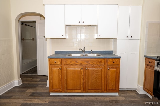 2363 Niagara St, Buffalo, NY 14207 - kitchen featuring arched walkways, dark countertops, and dark wood-type flooring