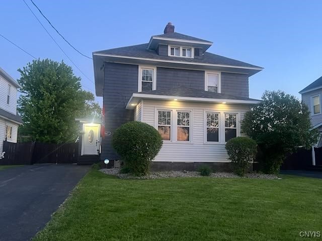 567 Grant Blvd, Syracuse, NY 13203 - traditional style home with a front lawn and a chimney