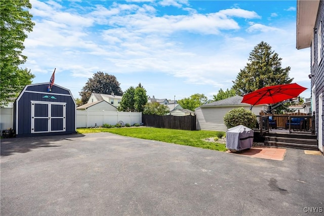 567 Grant Blvd, Syracuse, NY 13203 - view of patio featuring a storage unit, a deck, and a grill