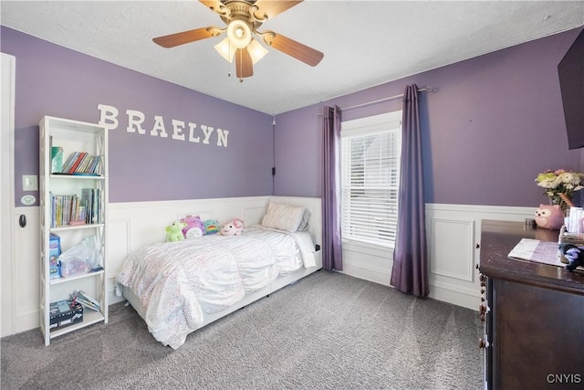 567 Grant Blvd, Syracuse, NY 13203 - carpeted bedroom with wainscoting and a ceiling fan