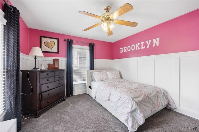 567 Grant Blvd, Syracuse, NY 13203 - bedroom with carpet floors, a wainscoted wall, ceiling fan, and a decorative wall