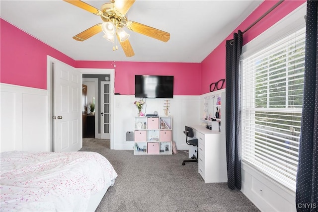 567 Grant Blvd, Syracuse, NY 13203 - bedroom featuring carpet flooring, a ceiling fan, and a wainscoted wall