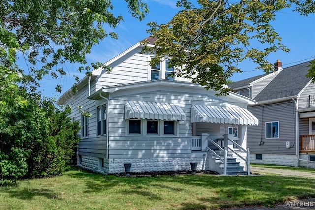 185 N Pleasant Pkwy, Cheektowaga, NY 14206 - back of house featuring a lawn