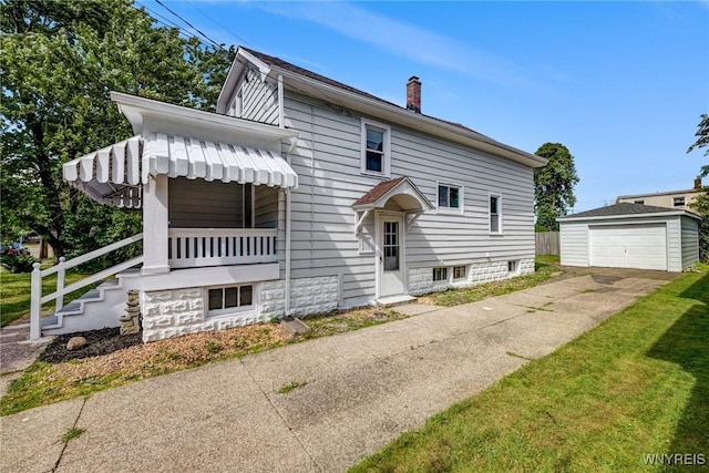 185 N Pleasant Pkwy, Cheektowaga, NY 14206 - view of front of home with an outdoor structure, concrete driveway, a chimney, and a detached garage