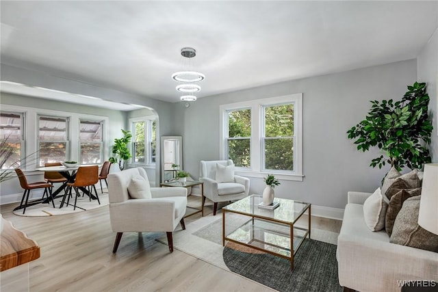 185 N Pleasant Pkwy, Cheektowaga, NY 14206 - living area featuring light wood-style floors and arched walkways