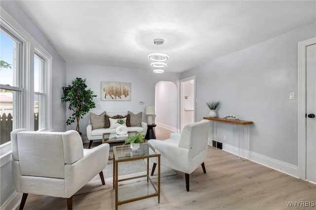 185 N Pleasant Pkwy, Cheektowaga, NY 14206 - living area featuring arched walkways and wood finished floors