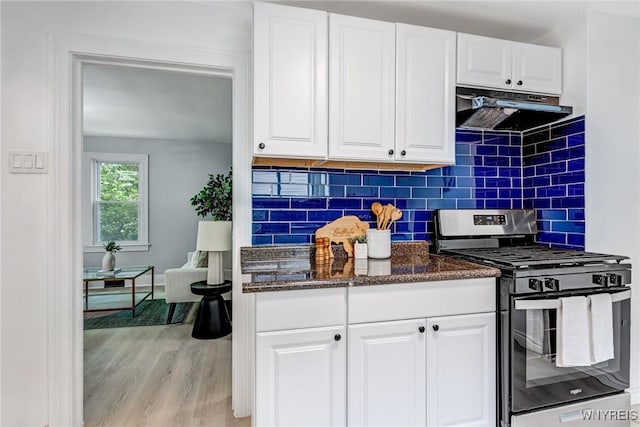 185 N Pleasant Pkwy, Cheektowaga, NY 14206 - kitchen with gas stove, extractor fan, backsplash, white cabinetry, and light wood-type flooring