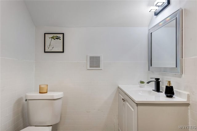 185 N Pleasant Pkwy, Cheektowaga, NY 14206 - half bath with tile walls, vanity, and wainscoting