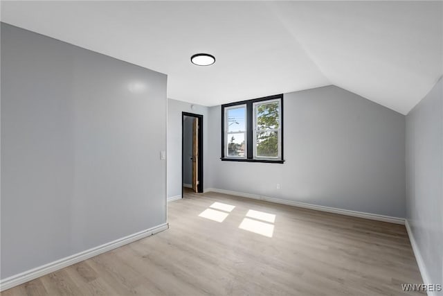 185 N Pleasant Pkwy, Cheektowaga, NY 14206 - additional living space with light wood-style floors and lofted ceiling