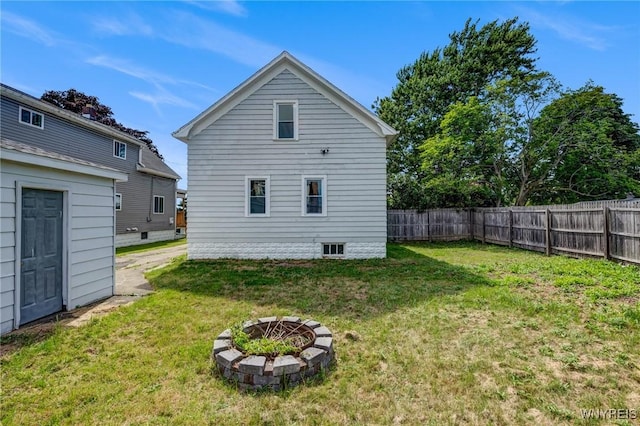 185 N Pleasant Pkwy, Cheektowaga, NY 14206 - back of property with an outdoor fire pit and a fenced backyard