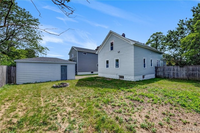 185 N Pleasant Pkwy, Cheektowaga, NY 14206 - rear view of house featuring an outdoor structure and a chimney