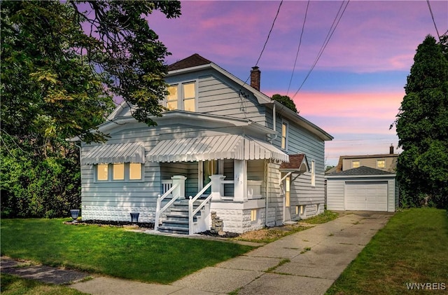 185 N Pleasant Pkwy, Cheektowaga, NY 14206 - view of front of home with an outbuilding, driveway, a yard, a chimney, and a detached garage