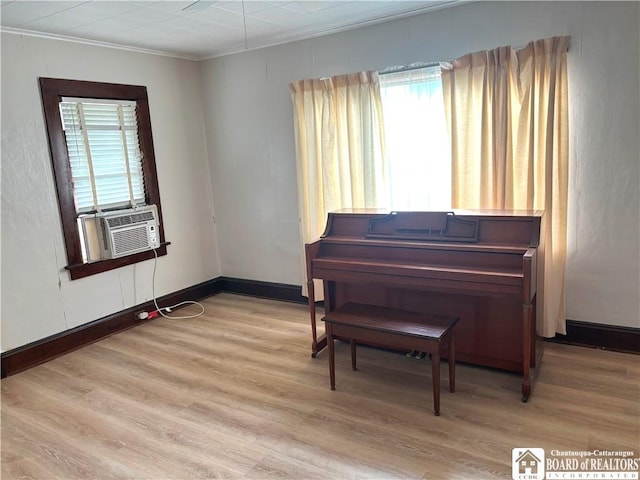 11 Elm St, Hanover, NY 14136 - sitting room featuring wood finished floors, ornamental molding, and cooling unit