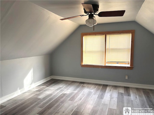 11 Elm St, Hanover, NY 14136 - additional living space with vaulted ceiling, wood finished floors, and ceiling fan