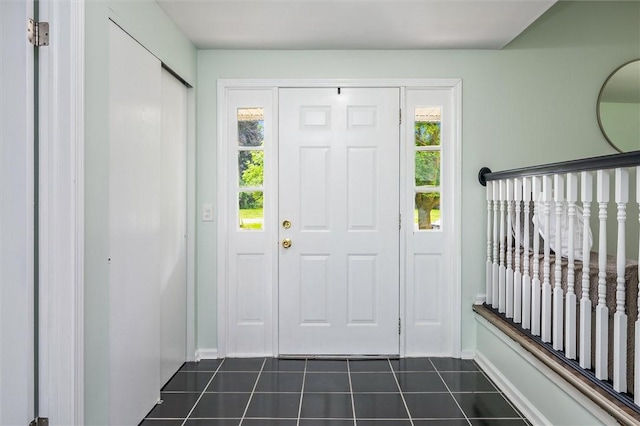 42 Twin Circle Dr, Gates, NY 14624 - foyer with dark tile patterned flooring and plenty of natural light