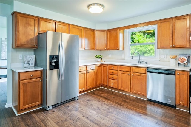 42 Twin Circle Dr, Gates, NY 14624 - kitchen featuring stainless steel appliances, dark wood-style floors, light countertops, and backsplash