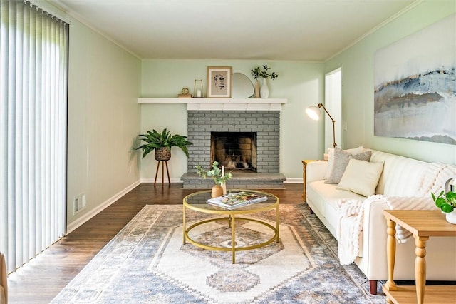 42 Twin Circle Dr, Gates, NY 14624 - living room with wood finished floors, crown molding, and a fireplace