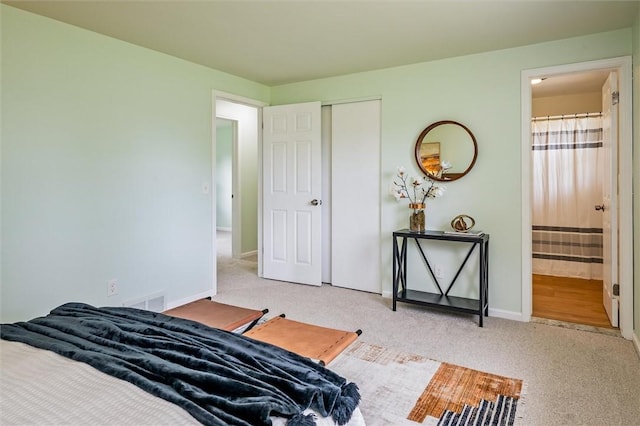 42 Twin Circle Dr, Gates, NY 14624 - carpeted bedroom featuring a closet and ensuite bathroom