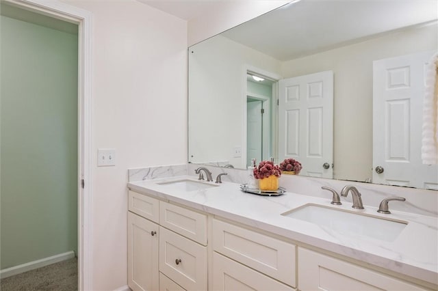 42 Twin Circle Dr, Gates, NY 14624 - bathroom with double vanity and baseboards