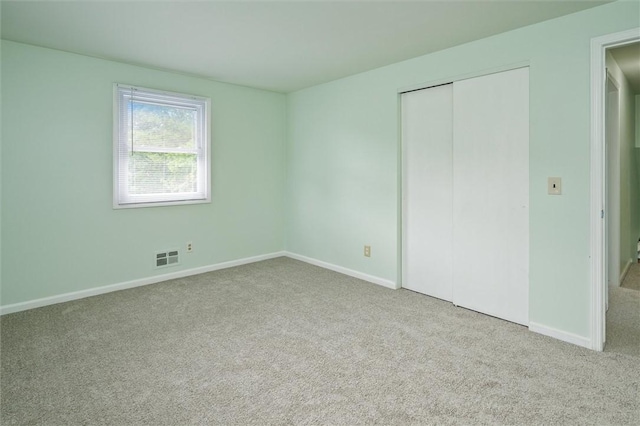 42 Twin Circle Dr, Gates, NY 14624 - unfurnished bedroom featuring carpet and a closet