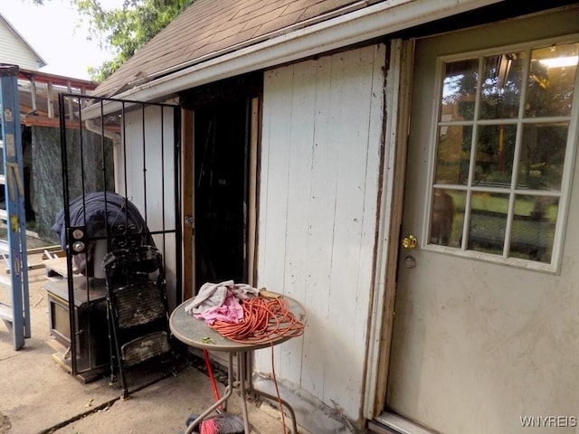 218 Strauss St, Buffalo, NY 14211 - property entrance featuring roof with shingles