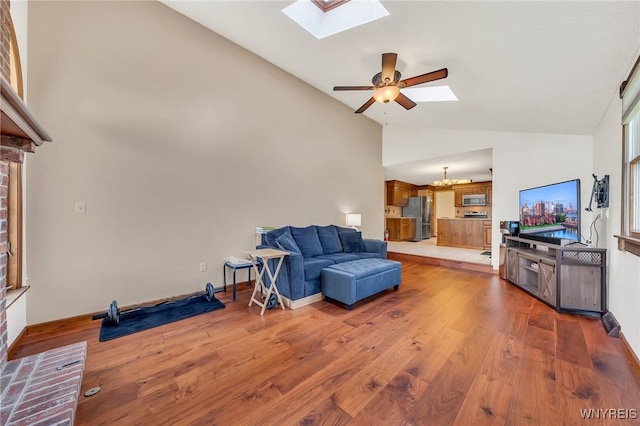 6103 Reger Dr, Lockport Town, NY 14094 - living area with a skylight, ceiling fan, light wood finished floors, and high vaulted ceiling
