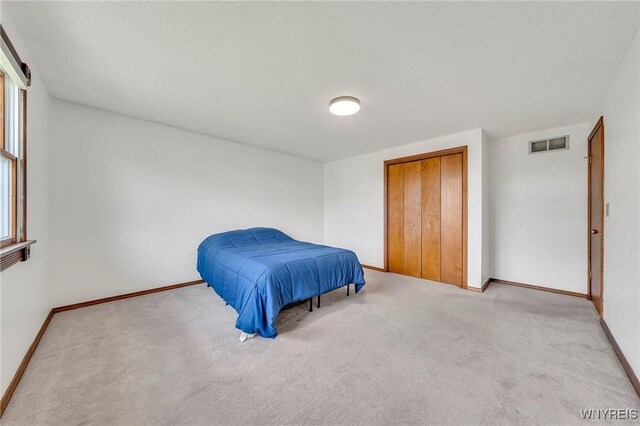6103 Reger Dr, Lockport Town, NY 14094 - bedroom featuring baseboards and carpet