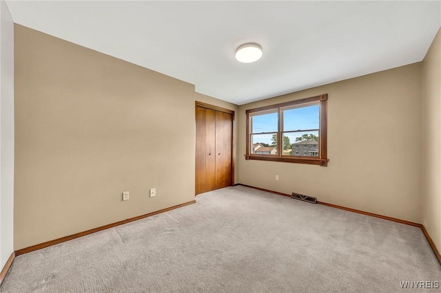 6103 Reger Dr, Lockport Town, NY 14094 - unfurnished bedroom with light colored carpet and a closet