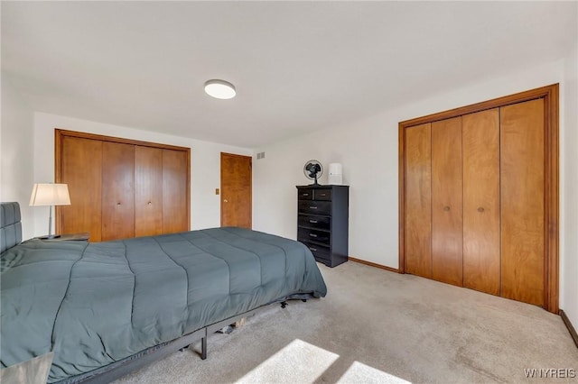 6103 Reger Dr, Lockport Town, NY 14094 - bedroom featuring light colored carpet and multiple closets