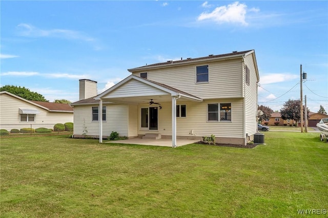 6103 Reger Dr, Lockport Town, NY 14094 - back of house featuring ceiling fan, a patio area, a yard, and a chimney
