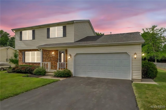 6103 Reger Dr, Lockport Town, NY 14094 - traditional home with driveway, a garage, and a lawn