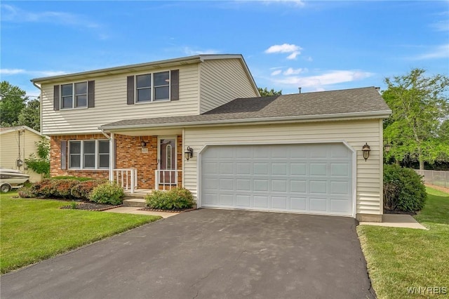 6103 Reger Dr, Lockport Town, NY 14094 - view of front of home featuring driveway, a garage, a front lawn, and brick siding