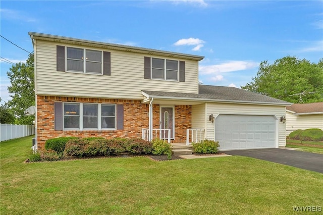 6103 Reger Dr, Lockport Town, NY 14094 - view of front of property featuring brick siding, a garage, and asphalt driveway
