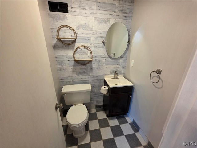 3978 Thrush Ln, Clay, NY 13090 - bathroom with tile patterned floors, vanity, and wood walls