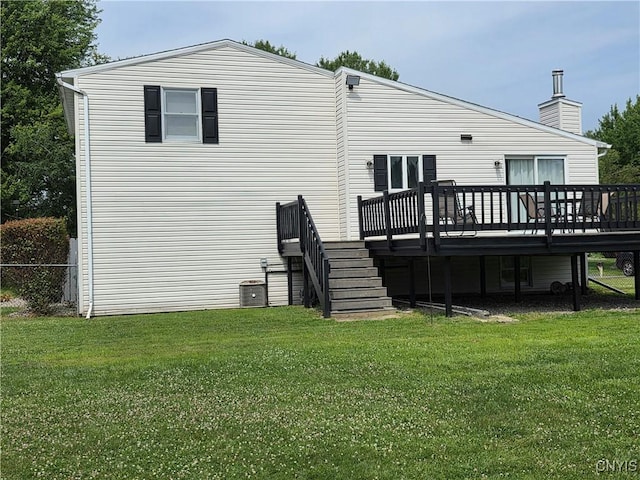 3978 Thrush Ln, Clay, NY 13090 - back of house featuring a wooden deck, a lawn, and a chimney