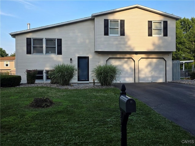 3978 Thrush Ln, Clay, NY 13090 - view of front facade featuring an attached garage, asphalt driveway, and a front lawn