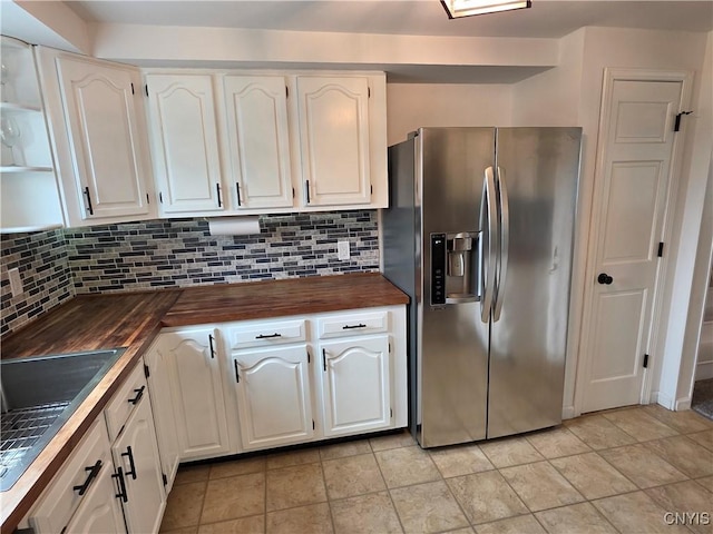 3978 Thrush Ln, Clay, NY 13090 - kitchen with stainless steel fridge with ice dispenser, butcher block counters, white cabinetry, and tasteful backsplash